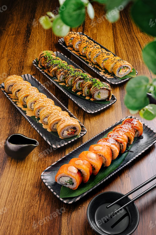 Preview: Sushi platter with assorted rolls presented on wooden table