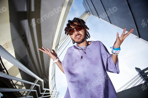 Preview: Portrait of Young Adult Man Shrugging Outdoors in Urban Environment
