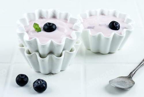 Preview: Bowl of Purple Blueberry Yogurt Isolated on White