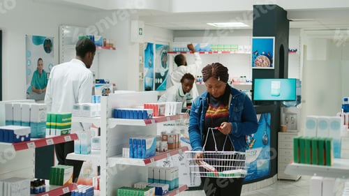 Preview: Female client taking boxes of pills and vitamins