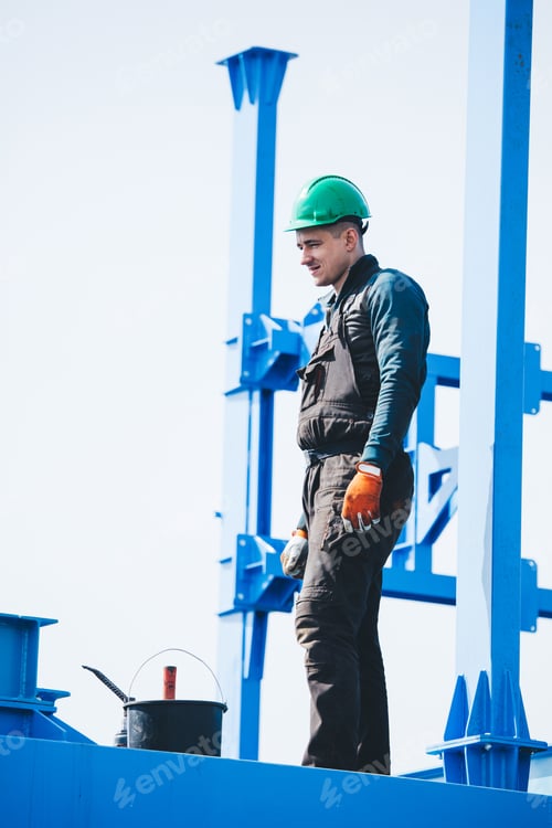 Preview: Manual worker working at shipyard construction site