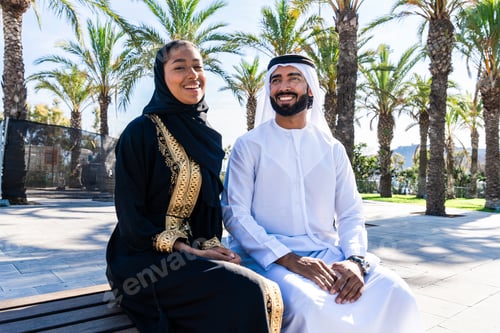 Preview: Traditional arab couple wearing emirati clothing dating outdoors