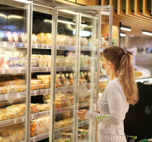 Preview: Woman Choosing Frozen Food From A Supermarket Freeze.Supermarket Shopping, Face Mask