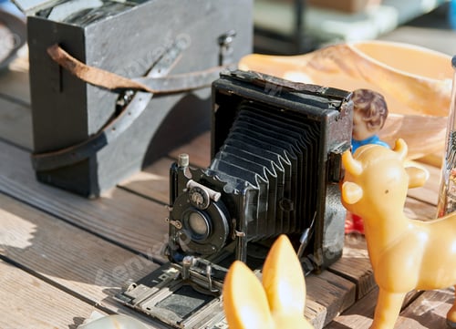 Preview: Close-up photo of vintage camera for sale at flea market