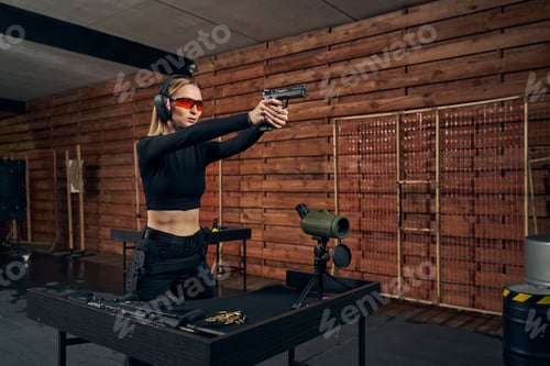 Preview: Woman Aims Handgun at Indoor Firing Range
