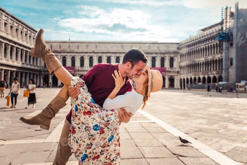 Preview: Romantic couple in love kissing in the city of Venice, Italy.