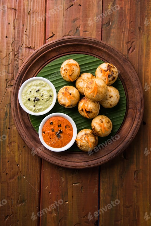 Preview: Delicious Appam with Colorful Sauces on Wooden Tray