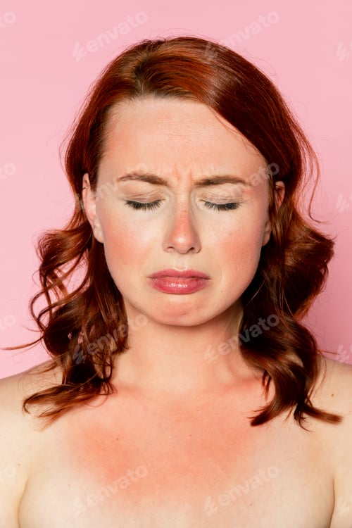 Preview: Sad woman with sunburnt skin