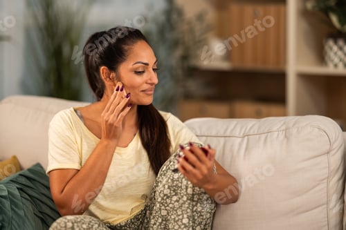 Preview: Woman Applies Makeup in Bright Living Room