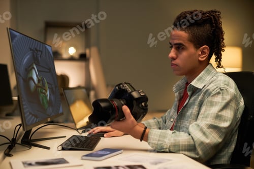 Preview: Photographer retouching photo on computer