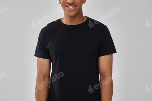 Preview: happy fashionable african american man in casual stylish black t-shirt, copy space for advertising