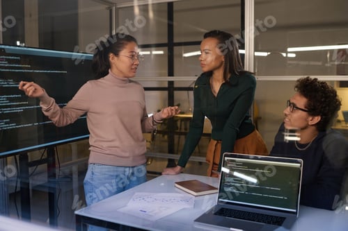 Preview: IT Specialists Working Together In Evening