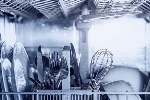 Preview: Open dishwasher with clean utensil inside, cutlery, glasses, dishes at kitchen