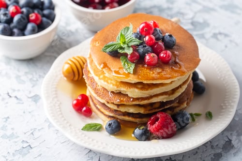 Preview: Healthy summer breakfast, homemade classic american pancakes with fresh fruit and honey, morning