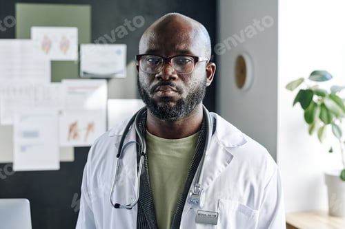 Preview: African male doctor in white coat