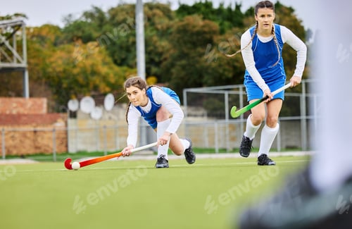 Preview: Fitness, workout and female hockey players training for a game, match or tournament on an outdoor f