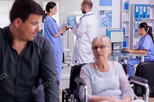 Preview: Ragiologist doctor examining radiography test result with nurse