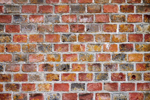 Preview: Red brick wall of old house, red brick texture, reliable brickwork masonry with bricklayer