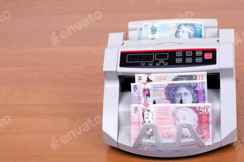 Preview: Scottish money in a counting machine