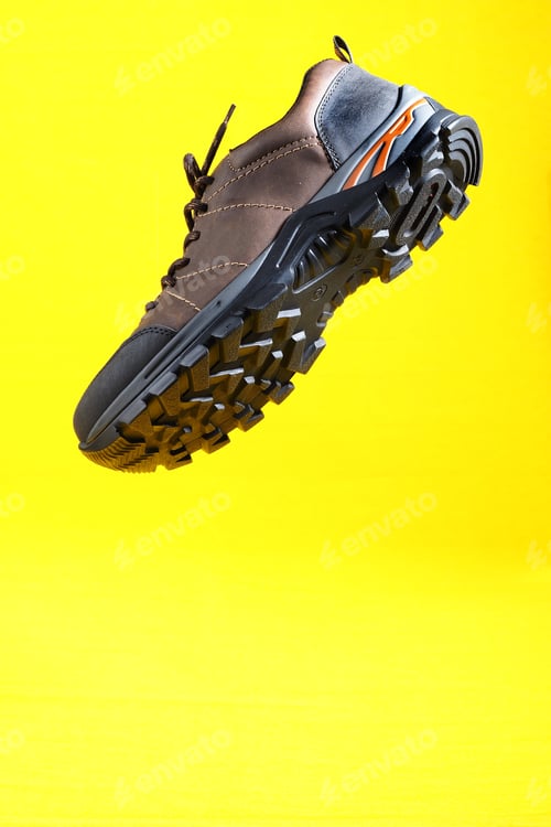 Preview: Men's shoes. Men's shoes, brown sneakers on a yellow background.