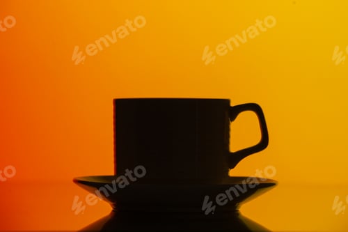 Preview: front view black tea cup in dark shadow on orange background color coffee photo bright ceremony food