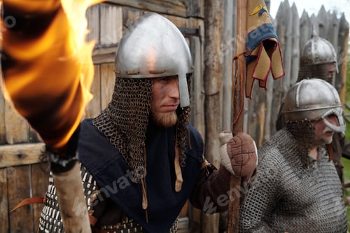 Preview: Reenactors Wearing Medieval Armor Holding Torches in Fort
