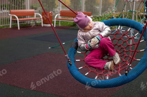 Preview: Exploring Joy and Imagination on a Vibrant Autumn Playground With a Playful Girl