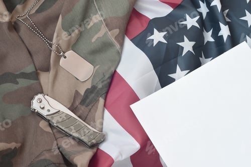 Preview: Army dog tag token and knife lies on Old Camouflage uniform and