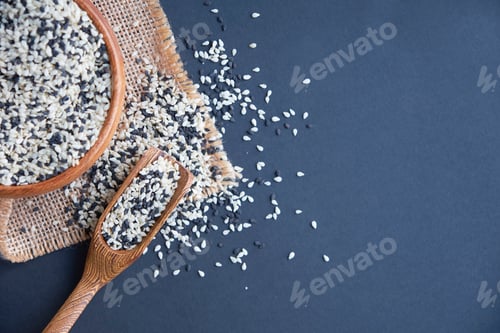 Preview: Organic natural sesame seeds wooden spoon. toasted sesame seeds.
