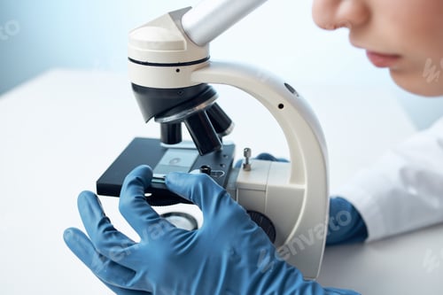 Preview: laboratory assistant sitting at the table microscope research biotechnology close-up