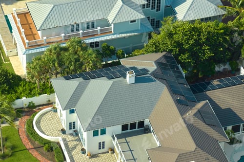 Preview: Aerial view of big expensive american building roof with blue solar photovoltaic panels