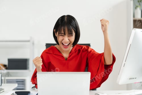 Preview: Successful business woman, excited young woman Keeping up arms and showing positive emotions