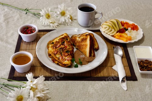 Preview: Breakfast containing omelet, sausage toasts, a cup of coffee and fresh fruits