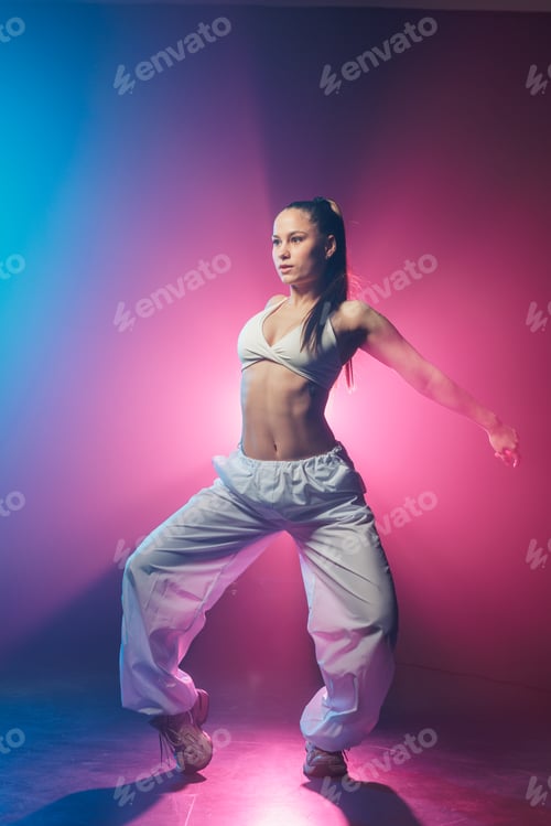 Preview: Neon hip hop jazz funk stance in blue and magenta studio lighting