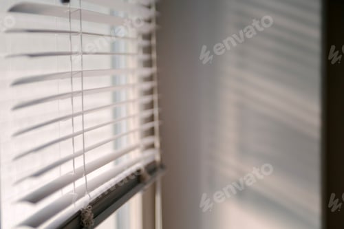 Preview: White blinds let in light. Shadows on the wall