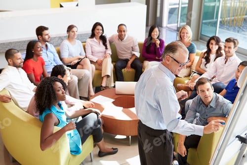 Preview: Businessman Making Presentation To Office Colleagues