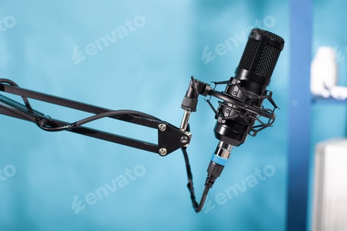 Preview: Closeup of professional microphone swivel boom arm stand in empty vlog broadcasting studio