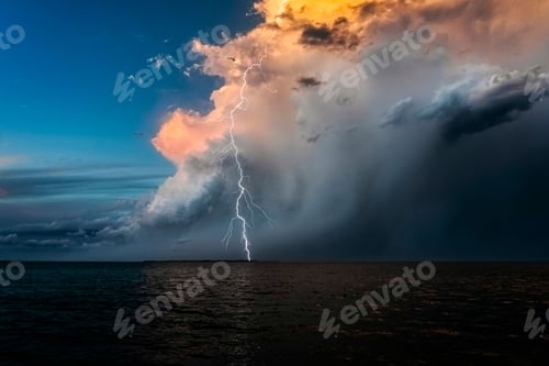 Preview: Beautiful shot of a cloudscape and lightning strike over a sea