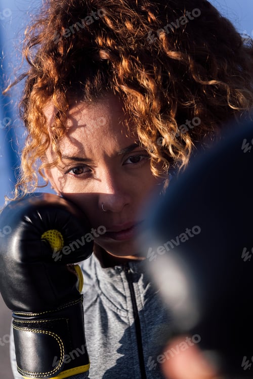 Preview: female boxer ready to workout with boxing gloves