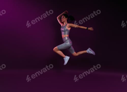 Preview: Side view of a slim sportswoman in silver fitness wear jumping against magenta background in studio