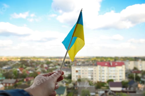 Preview: Ukraine flag. Large national symbol fluttering in blue sky. Small yellow blue Ukrainian state flag,