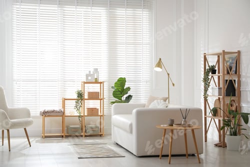 Preview: Stylish shelving unit with decor and sofa in room