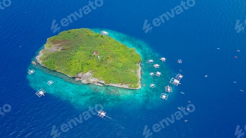 Preview: Aerial view of sandy beach with tourists swimming in beautiful clear sea water.