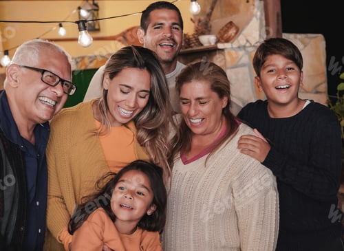 Preview: Happy latin family portrait at new years eve party