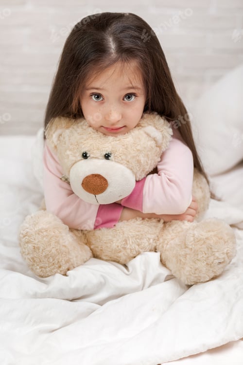 Preview: baby hugging a teddy bear