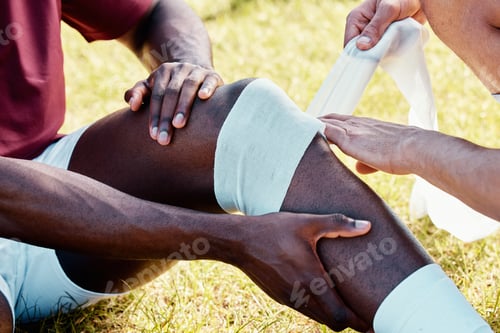 Preview: Rugby, knee injury and bandage with a sports black man on a field struggling with pain during a gam