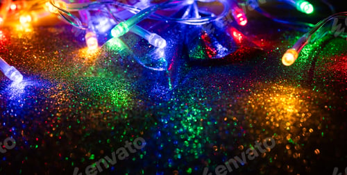 Preview: colorful Christmas lights on dark glitter background