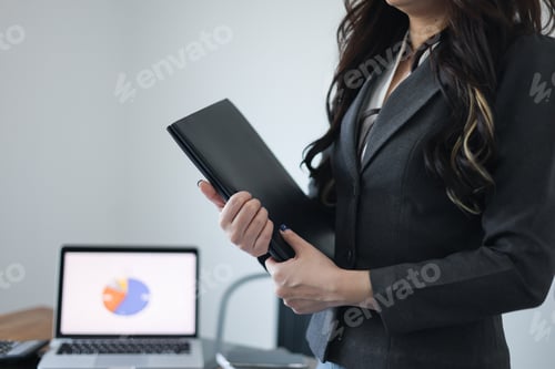 Preview: Businesswoman working in office.