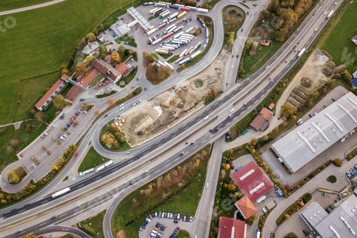Preview: Top down aerial view of freeway interstate road with moving traffic cars in rural area.