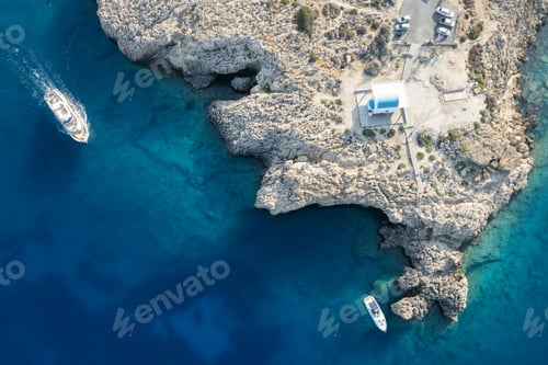 Preview: Drone aerial photograph of Cape Greko peninsula with Agioi Anargyroi church on the rocks. Cruise